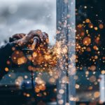 Person Grinding Metal Surface